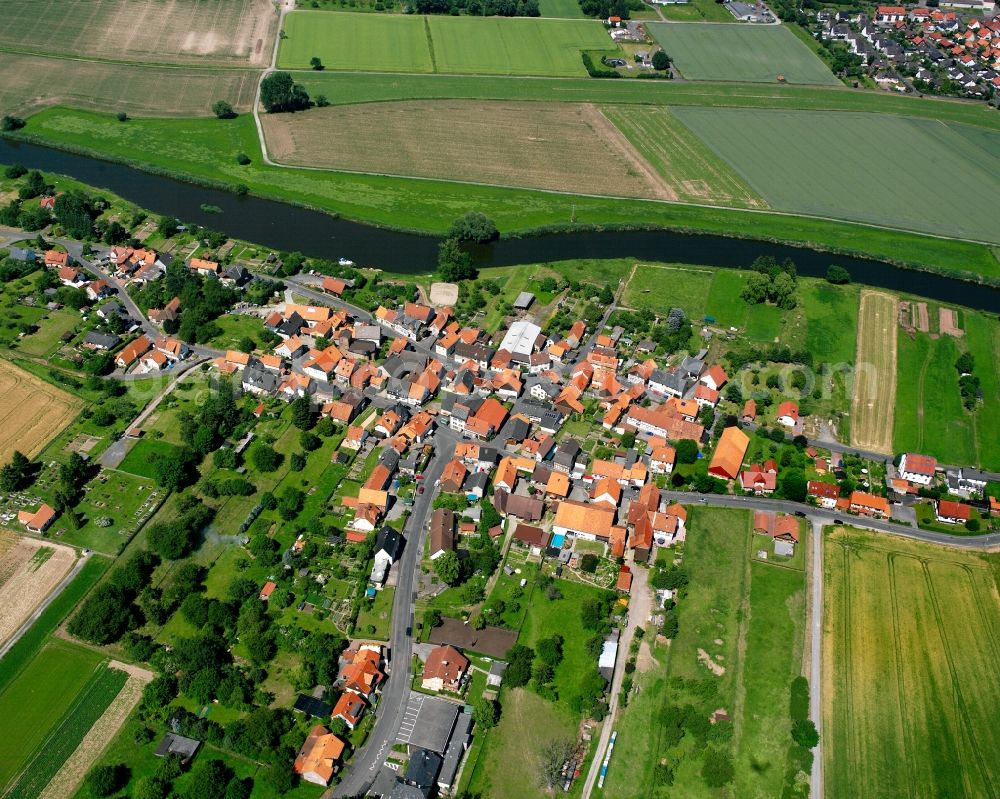 Oberode from above - Agricultural land and field boundaries surround the settlement area of the village in Oberode in the state Lower Saxony, Germany