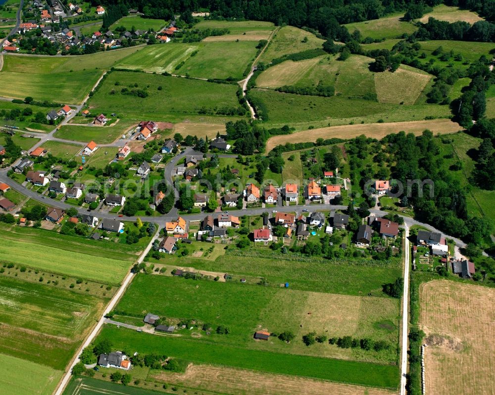 Oberode from the bird's eye view: Agricultural land and field boundaries surround the settlement area of the village in Oberode in the state Lower Saxony, Germany