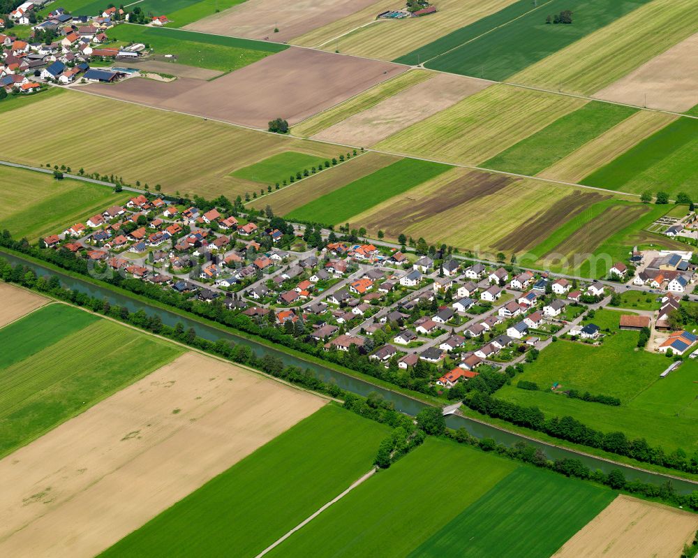 Oberopfingen from the bird's eye view: Agricultural land and field boundaries surround the settlement area of the village in Oberopfingen in the state Baden-Wuerttemberg, Germany