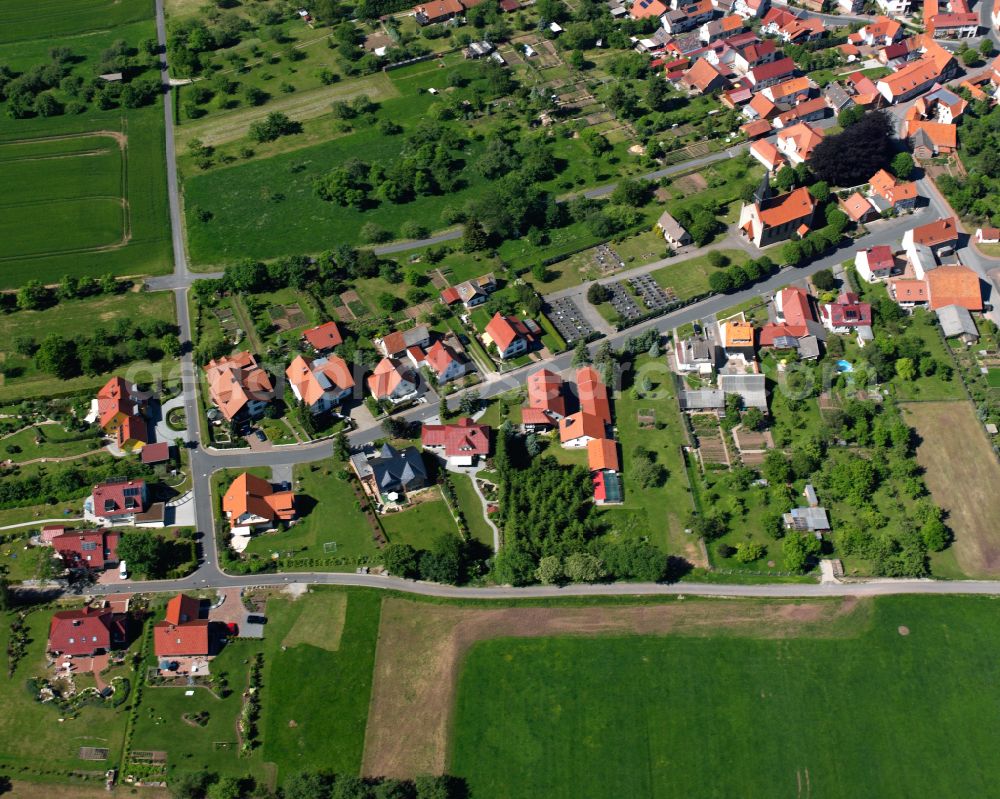 Aerial image Oberorschel - Agricultural land and field boundaries surround the settlement area of the village in Oberorschel in the state Thuringia, Germany