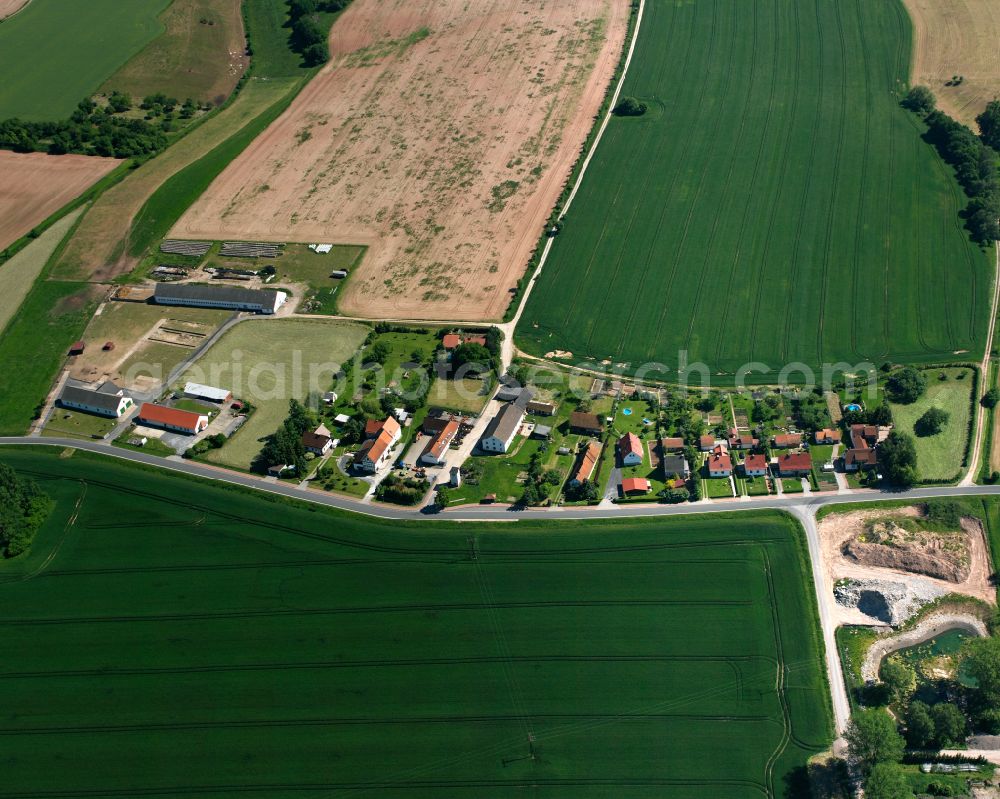 Aerial photograph Oberorschel - Agricultural land and field boundaries surround the settlement area of the village in Oberorschel in the state Thuringia, Germany