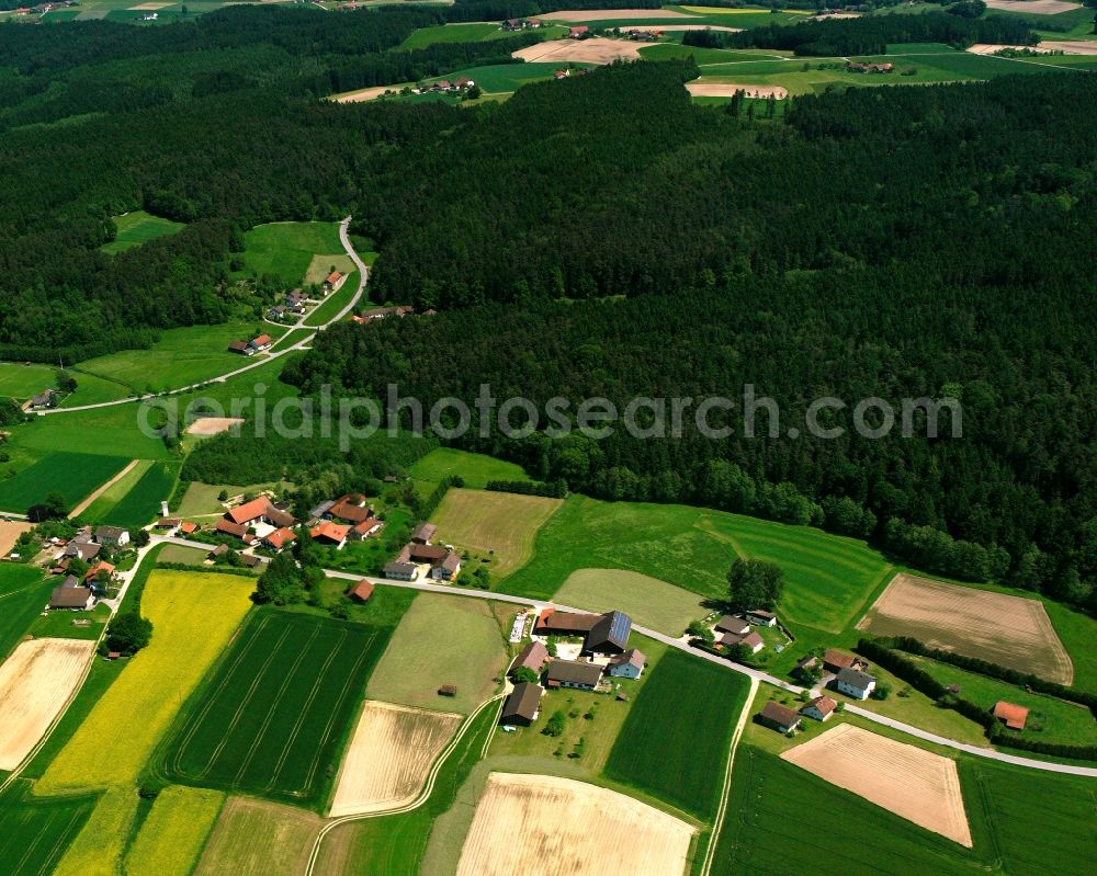 Oberradlsbach from above - Agricultural land and field boundaries surround the settlement area of the village in Oberradlsbach in the state Bavaria, Germany