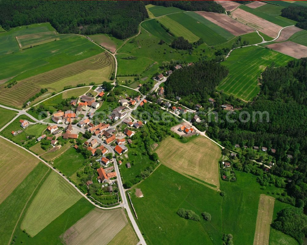 Oberramstadt from the bird's eye view: Agricultural land and field boundaries surround the settlement area of the village in Oberramstadt in the state Bavaria, Germany