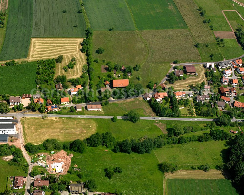 Oberreichenbach from above - Agricultural land and field boundaries surround the settlement area of the village in Oberreichenbach in the state Baden-Wuerttemberg, Germany