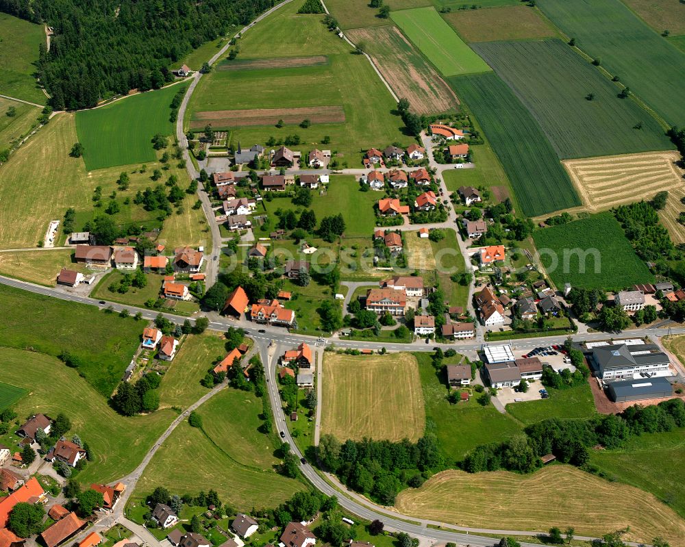 Oberreichenbach from the bird's eye view: Agricultural land and field boundaries surround the settlement area of the village in Oberreichenbach in the state Baden-Wuerttemberg, Germany