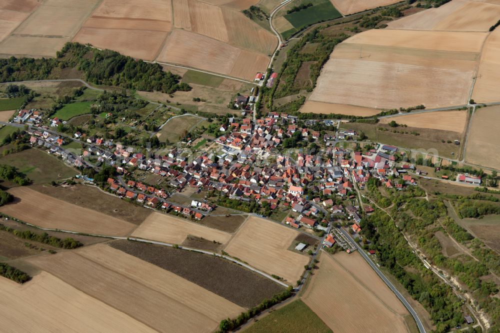 Obersfeld from the bird's eye view: Agricultural land and field boundaries surround the settlement area of the village in Obersfeld in the state Bavaria, Germany