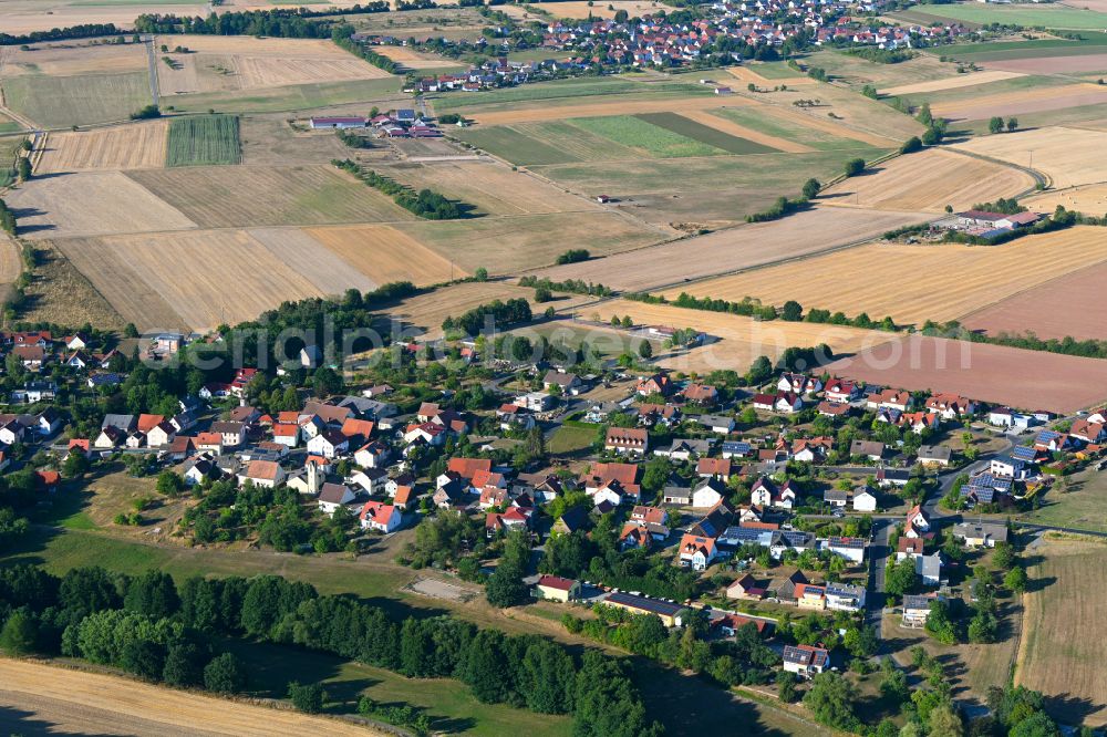 Aerial image Oberthulba - Agricultural land and field boundaries surround the settlement area of the village in Oberthulba in the state Bavaria, Germany