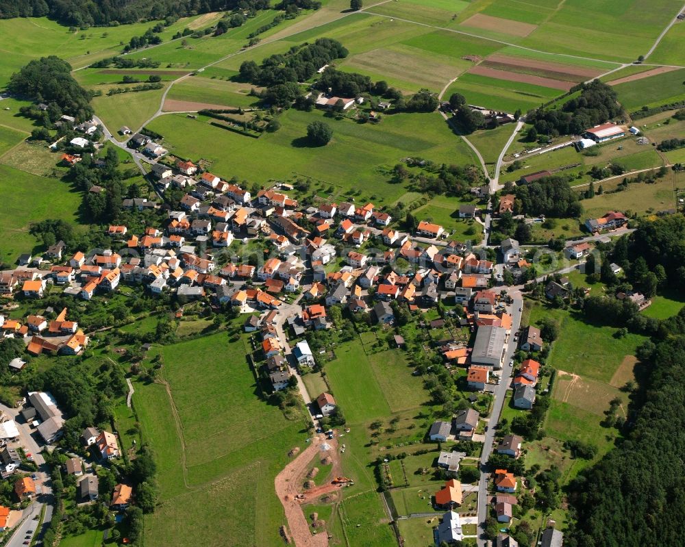 Oberzent from the bird's eye view: Agricultural land and field boundaries surround the settlement area of the village in Oberzent in the state Hesse, Germany