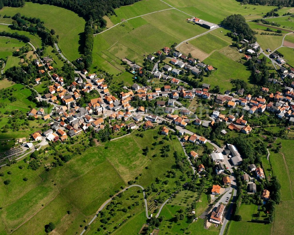 Aerial photograph Oberzent - Agricultural land and field boundaries surround the settlement area of the village in Oberzent in the state Hesse, Germany