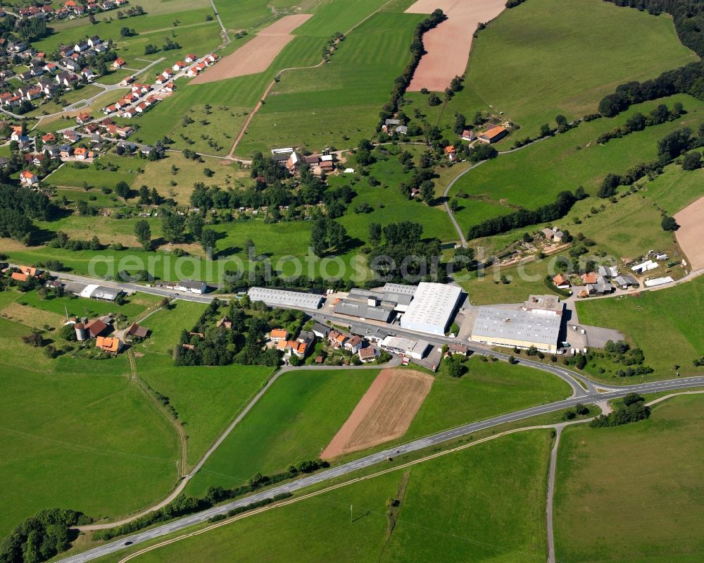 Aerial image Oberzent - Agricultural land and field boundaries surround the settlement area of the village in Oberzent in the state Hesse, Germany