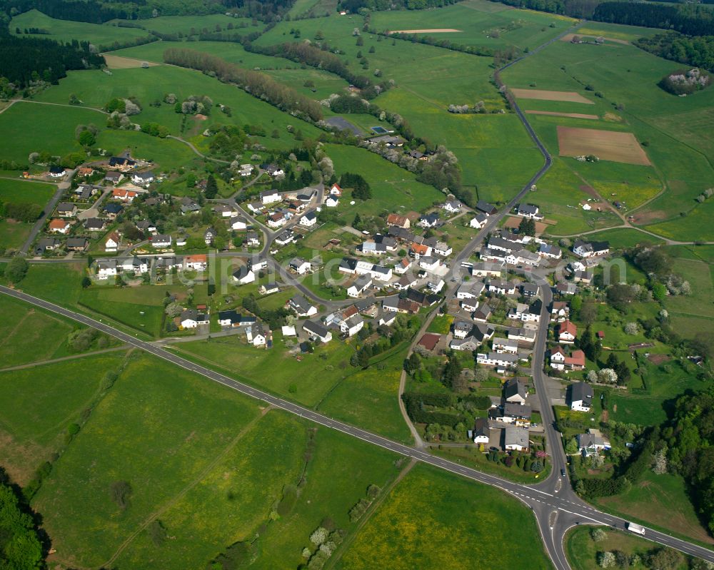 Aerial photograph Odersberg - Agricultural land and field boundaries surround the settlement area of the village in Odersberg in the state Hesse, Germany