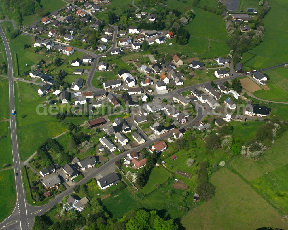 Odersberg from above - Agricultural land and field boundaries surround the settlement area of the village in Odersberg in the state Hesse, Germany