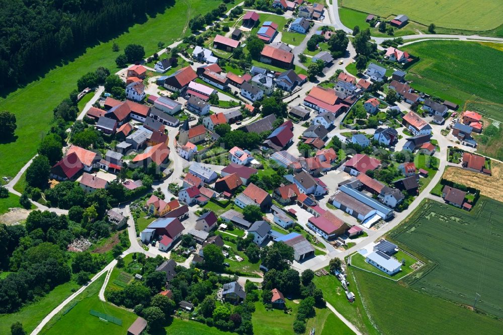 Aerial photograph Oening - Agricultural land and field boundaries surround the settlement area of the village in Oening in the state Bavaria, Germany