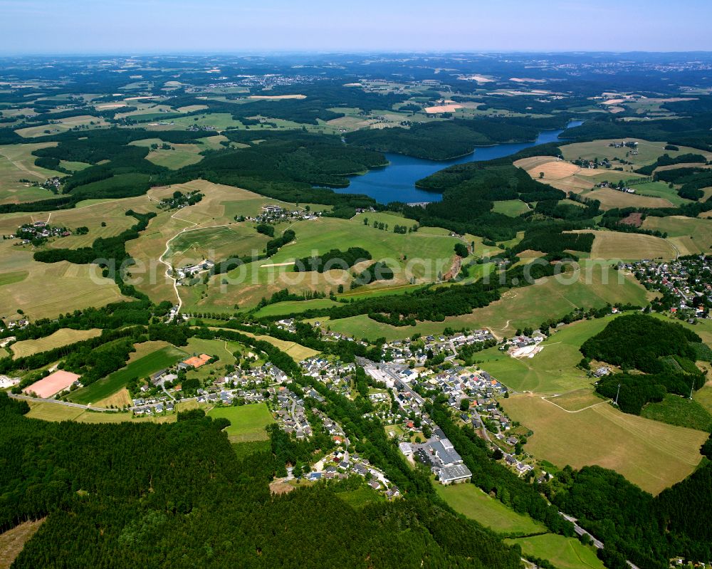 Ohl from the bird's eye view: Agricultural land and field boundaries surround the settlement area of the village in Ohl in the state North Rhine-Westphalia, Germany