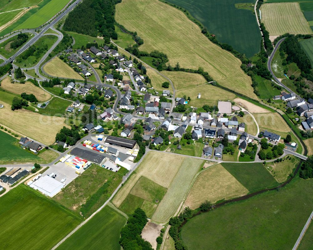 Ohlweiler from above - Agricultural land and field boundaries surround the settlement area of the village in Ohlweiler in the state Rhineland-Palatinate, Germany