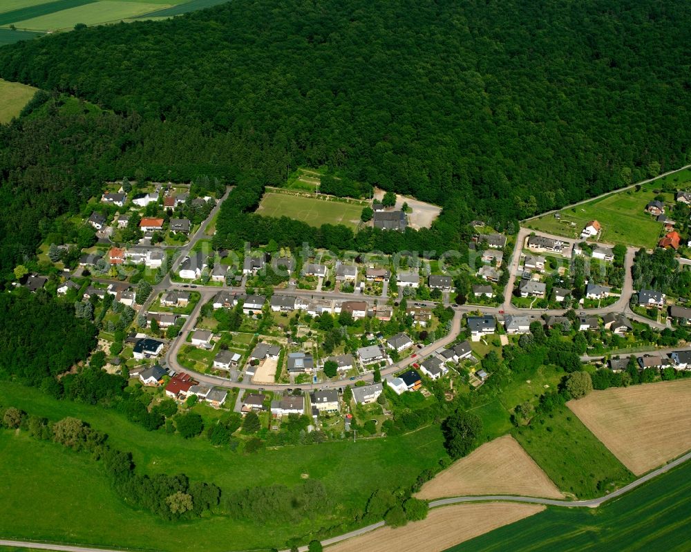 Ohren from the bird's eye view: Agricultural land and field boundaries surround the settlement area of the village in Ohren in the state Hesse, Germany