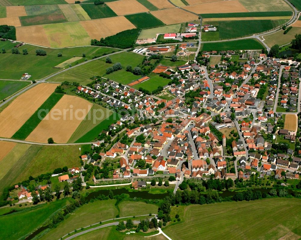 Ornbau from above - Agricultural land and field boundaries surround the settlement area of the village in Ornbau in the state Bavaria, Germany