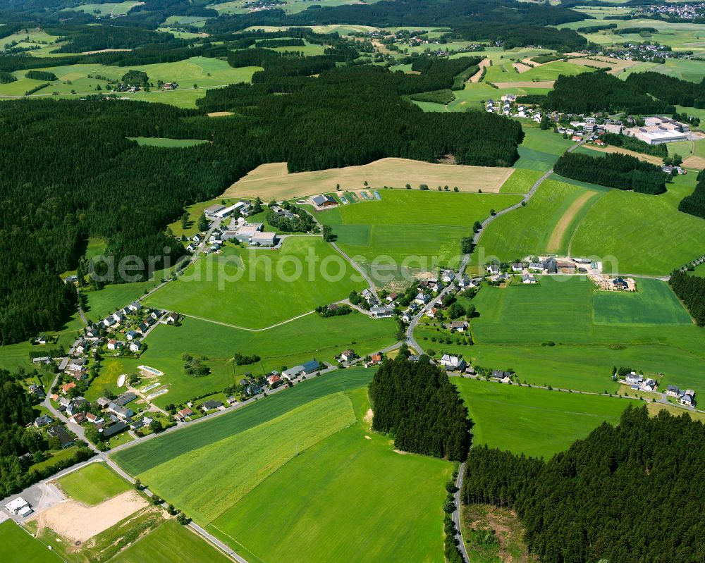 Aerial image Ort - Agricultural land and field boundaries surround the settlement area of the village in Ort in the state Bavaria, Germany