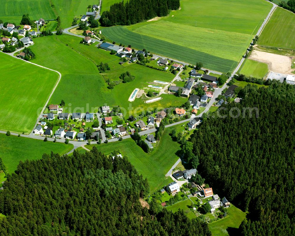 Aerial photograph Ort - Agricultural land and field boundaries surround the settlement area of the village in Ort in the state Bavaria, Germany