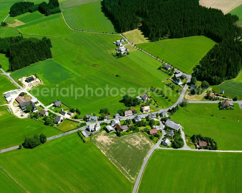 Ort from the bird's eye view: Agricultural land and field boundaries surround the settlement area of the village in Ort in the state Bavaria, Germany