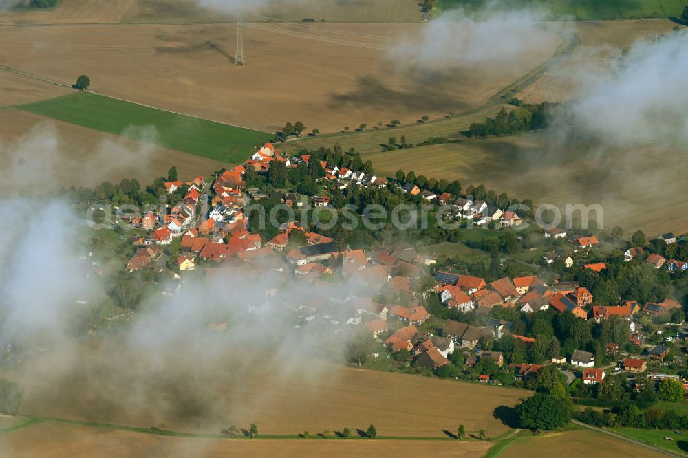 Aerial image Orxhausen - Agricultural land and field boundaries surround the settlement area of the village in Orxhausen in the state Lower Saxony, Germany