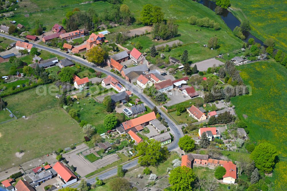 Osterburg (Altmark) from above - Agricultural land and field boundaries surround the settlement area of the village in Osterburg (Altmark) in the state Saxony-Anhalt, Germany