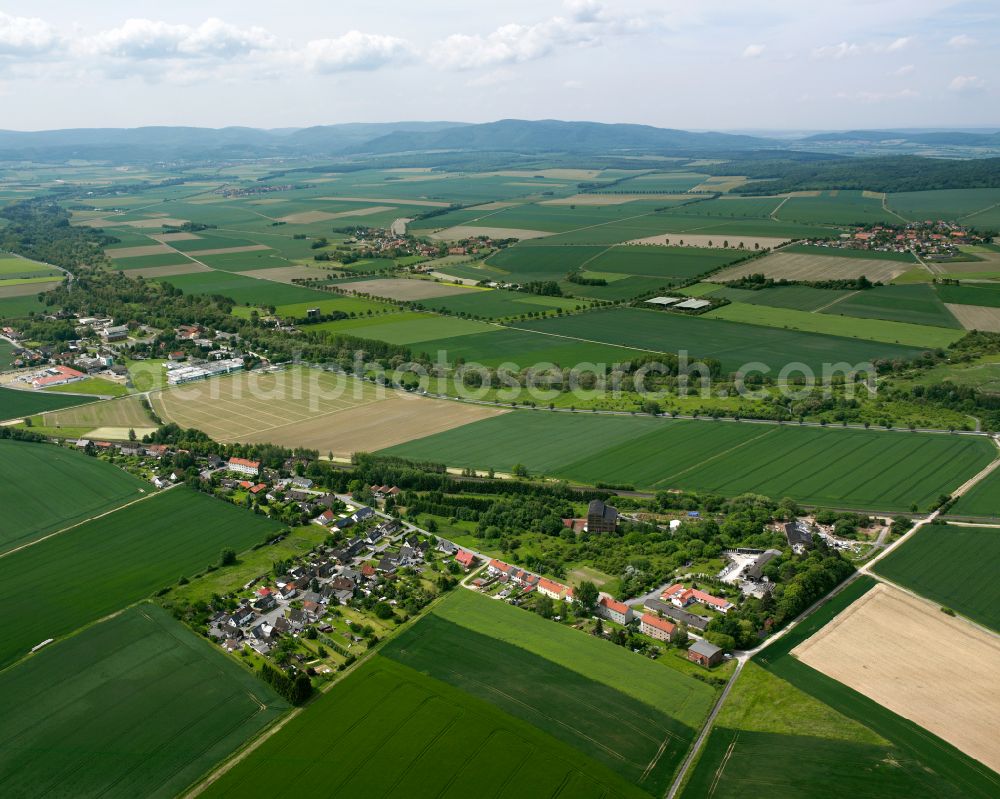 Othfresen from above - Agricultural land and field boundaries surround the settlement area of the village in Othfresen in the state Lower Saxony, Germany