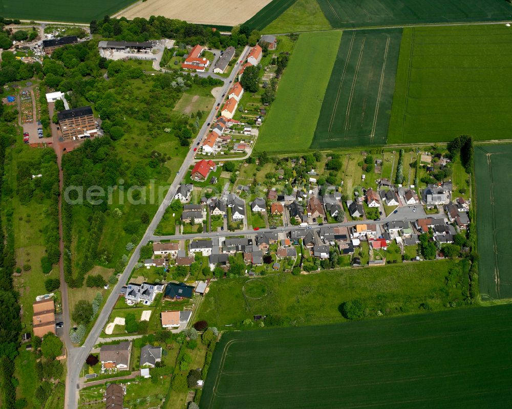 Othfresen from the bird's eye view: Agricultural land and field boundaries surround the settlement area of the village in Othfresen in the state Lower Saxony, Germany