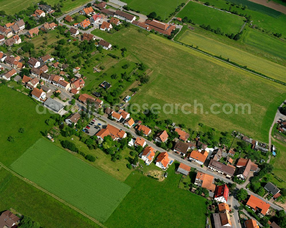 Ottenbronn from above - Agricultural land and field boundaries surround the settlement area of the village in Ottenbronn in the state Baden-Wuerttemberg, Germany