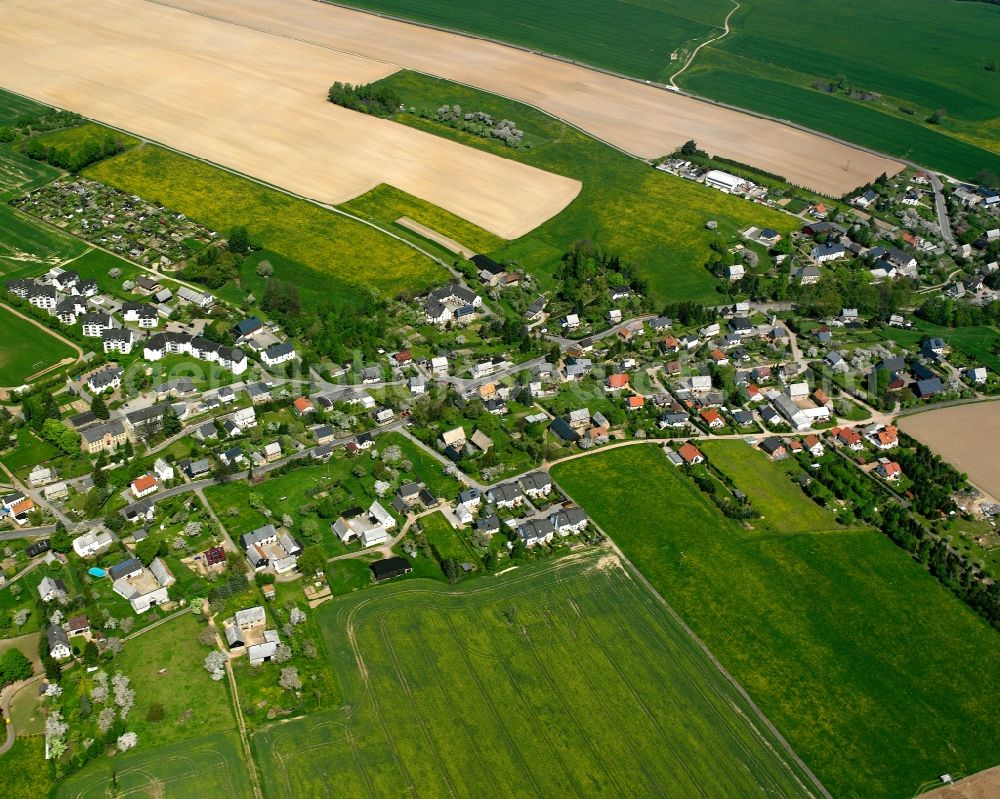 Ottendorf from the bird's eye view: Agricultural land and field boundaries surround the settlement area of the village in Ottendorf in the state Saxony, Germany