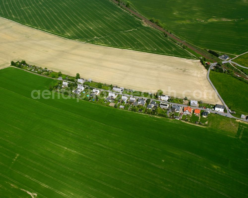 Aerial photograph Ottendorf - Agricultural land and field boundaries surround the settlement area of the village in Ottendorf in the state Saxony, Germany