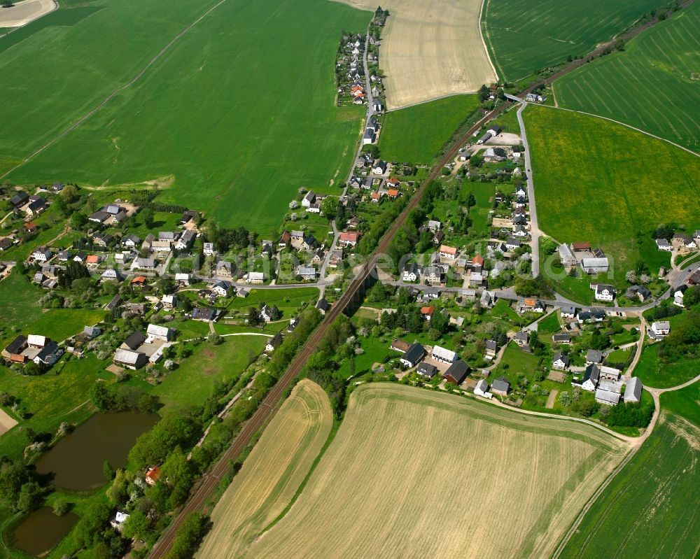 Ottendorf from above - Agricultural land and field boundaries surround the settlement area of the village in Ottendorf in the state Saxony, Germany