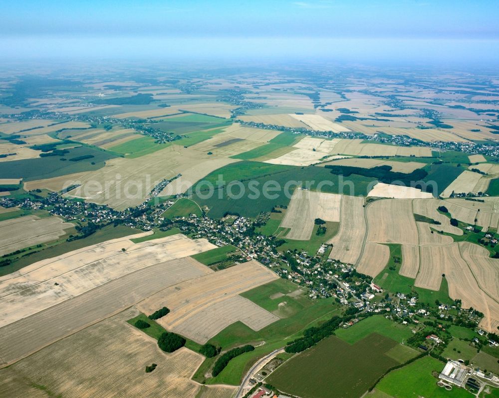 Ottendorf from above - Agricultural land and field boundaries surround the settlement area of the village in Ottendorf in the state Saxony, Germany