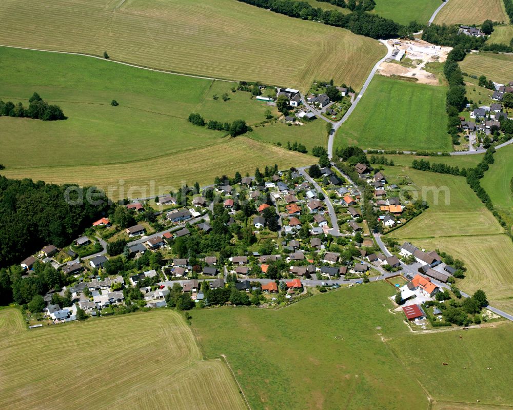 Aerial photograph Padberg - Agricultural land and field boundaries surround the settlement area of the village in Padberg in the state North Rhine-Westphalia, Germany