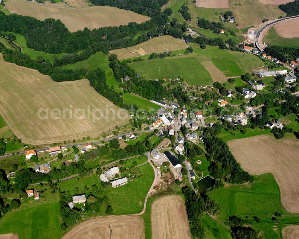 Pappendorf from above - Agricultural land and field boundaries surround the settlement area of the village in Pappendorf in the state Saxony, Germany