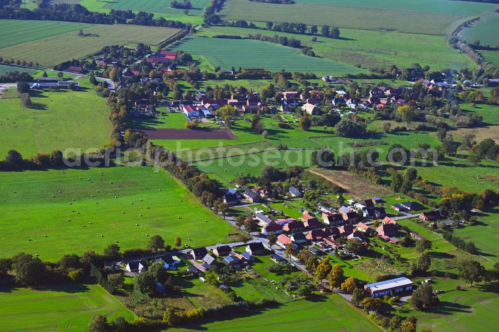 Perdöhl from above - Agricultural land and field boundaries surround the settlement area of the village in Perdoehl in the state Mecklenburg - Western Pomerania, Germany