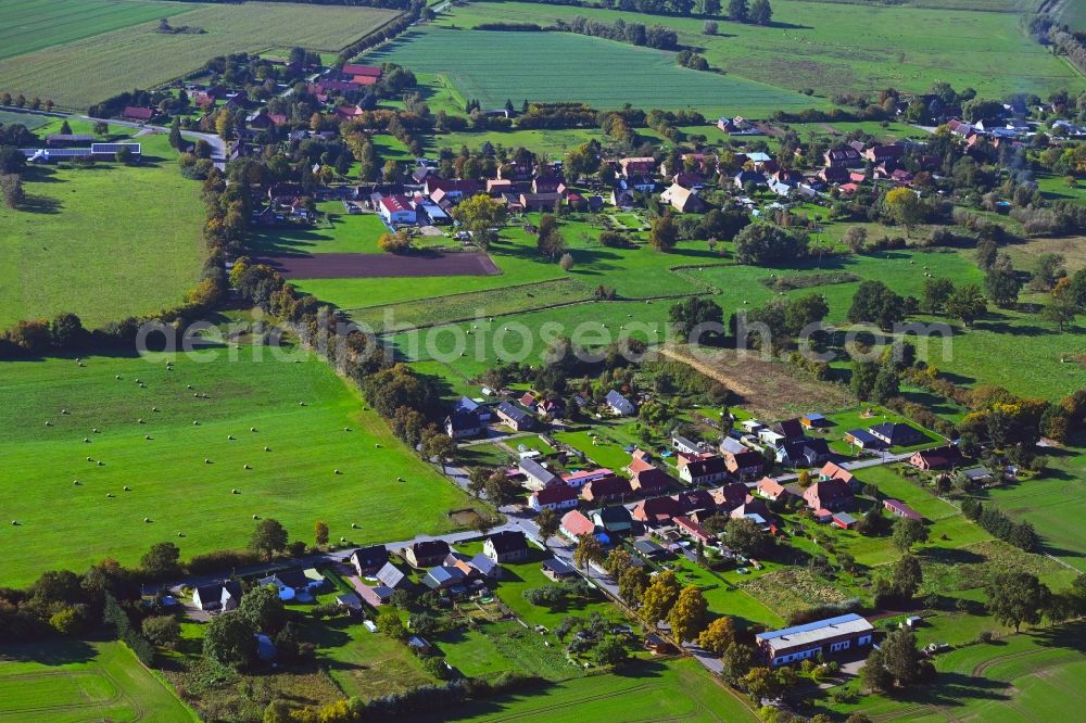 Perdöhl from the bird's eye view: Agricultural land and field boundaries surround the settlement area of the village in Perdoehl in the state Mecklenburg - Western Pomerania, Germany