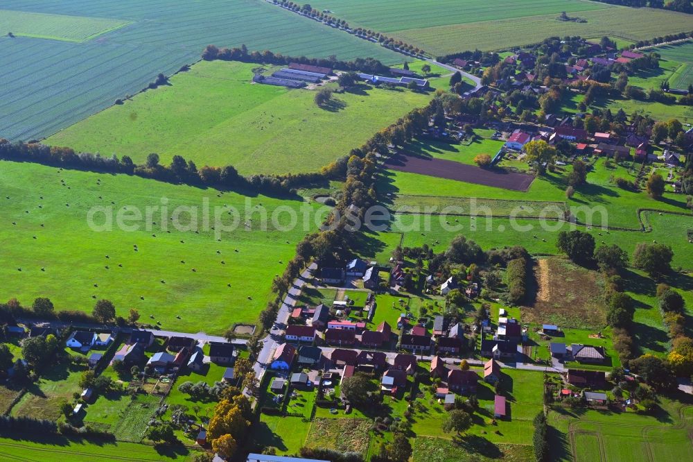 Aerial image Perdöhl - Agricultural land and field boundaries surround the settlement area of the village in Perdoehl in the state Mecklenburg - Western Pomerania, Germany