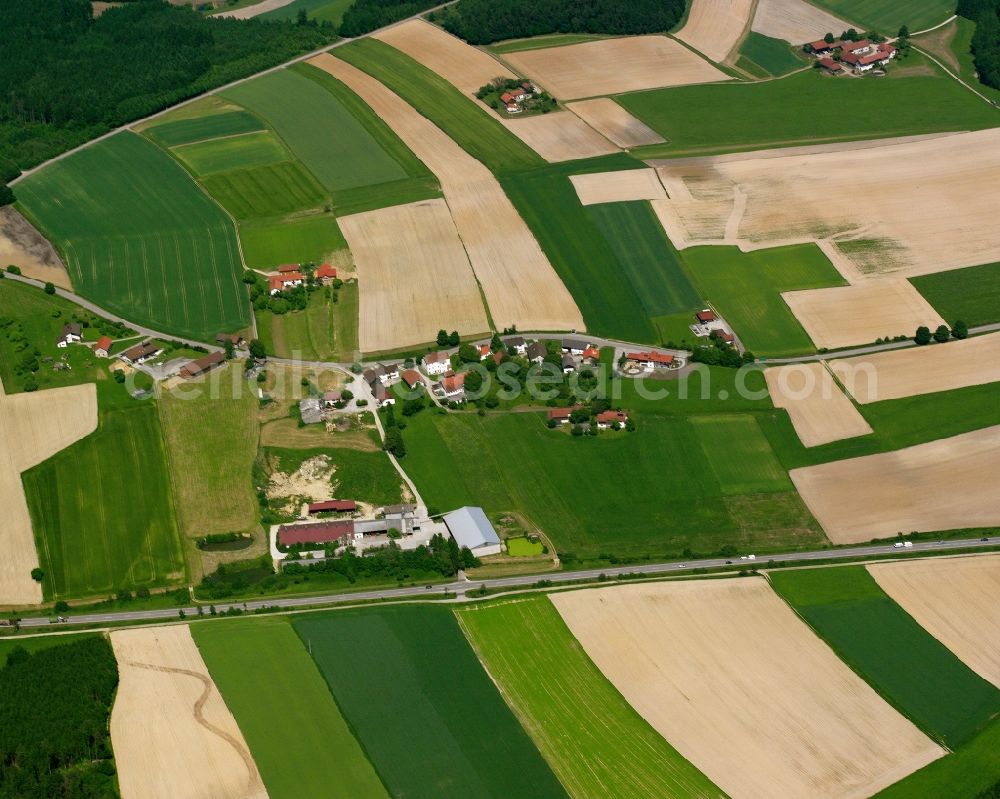 Aerial image Peterskirchen - Agricultural land and field boundaries surround the settlement area of the village in Peterskirchen in the state Bavaria, Germany