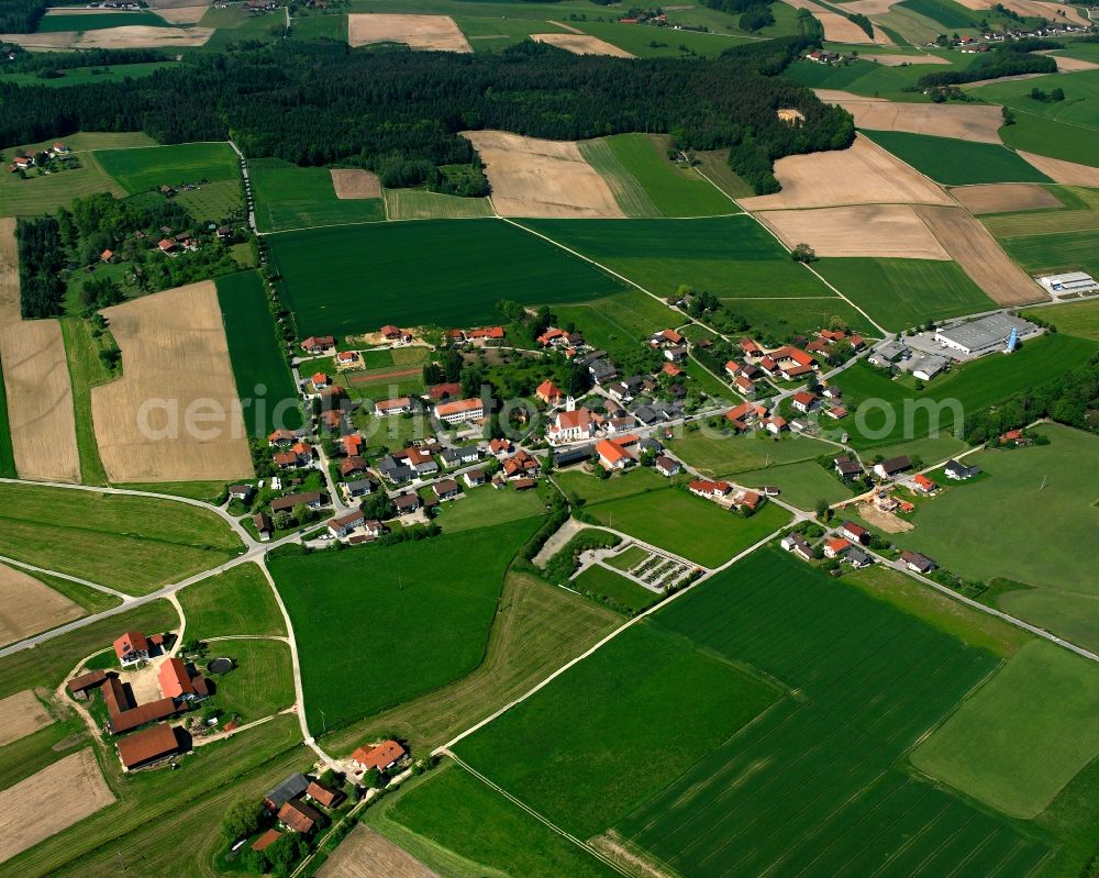 Aerial image Peterskirchen - Agricultural land and field boundaries surround the settlement area of the village in Peterskirchen in the state Bavaria, Germany