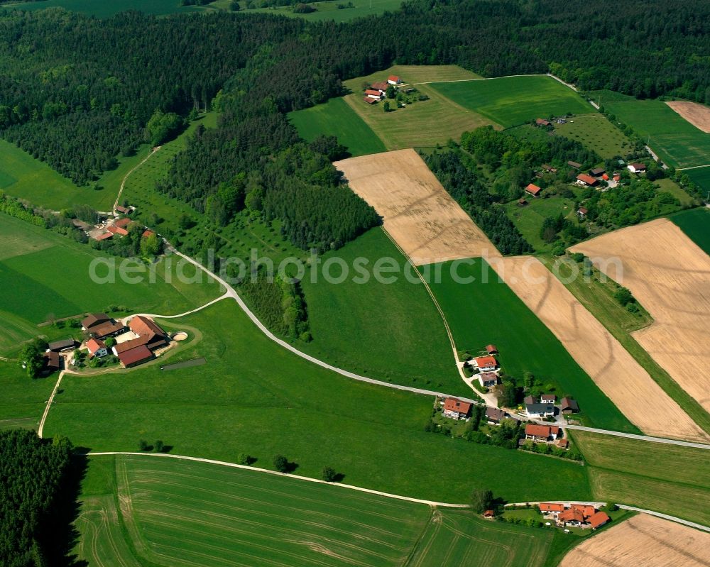 Aerial photograph Peterskirchen - Agricultural land and field boundaries surround the settlement area of the village in Peterskirchen in the state Bavaria, Germany