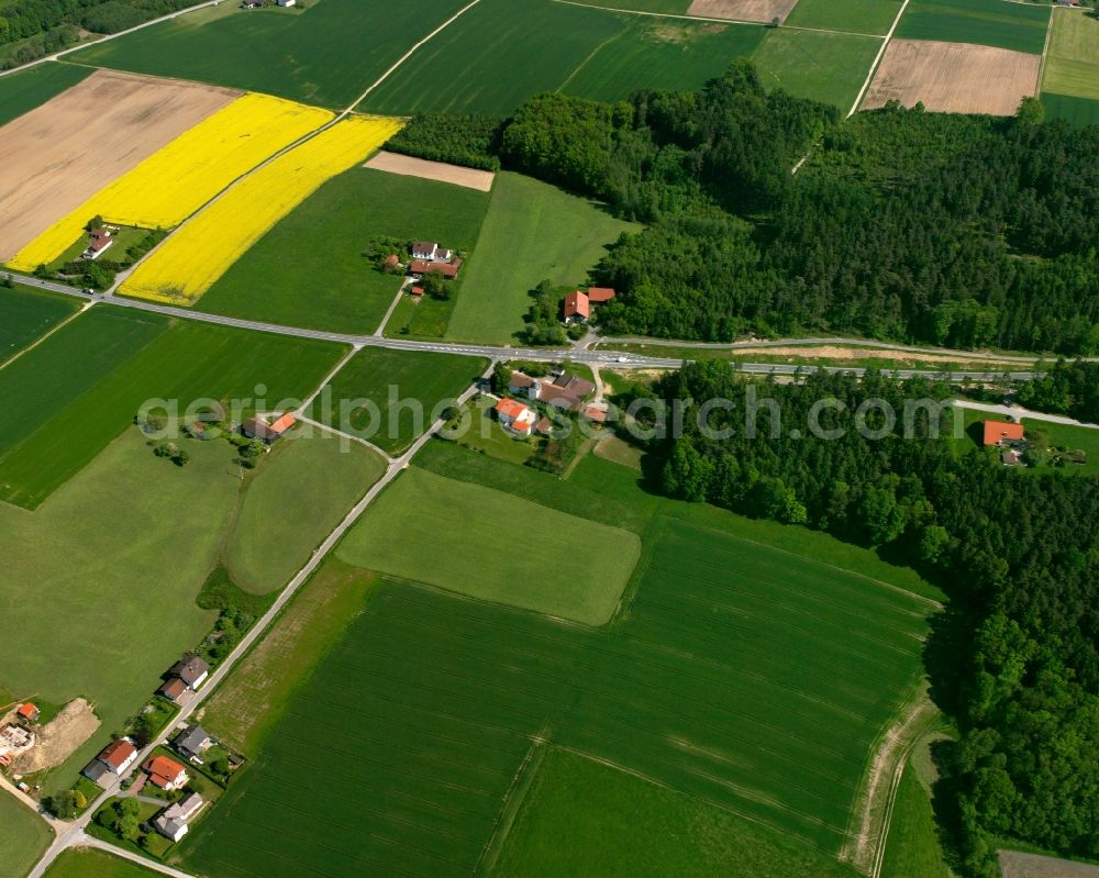 Aerial image Peterskirchen - Agricultural land and field boundaries surround the settlement area of the village in Peterskirchen in the state Bavaria, Germany