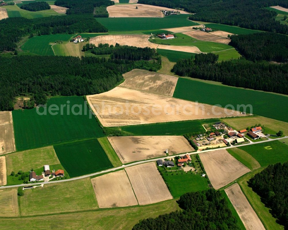 Aerial image Pfaffing - Agricultural land and field boundaries surround the settlement area of the village in Pfaffing in the state Bavaria, Germany