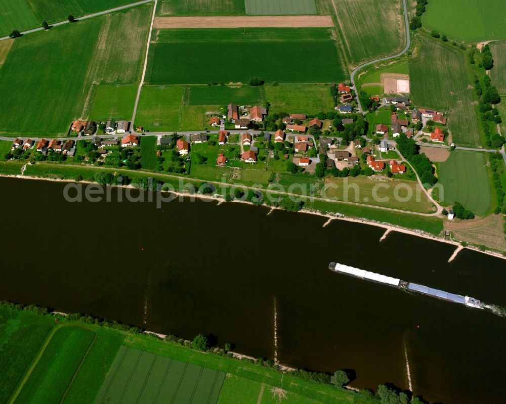 Aerial photograph Pfelling - Agricultural land and field boundaries surround the settlement area of the village in Pfelling in the state Bavaria, Germany