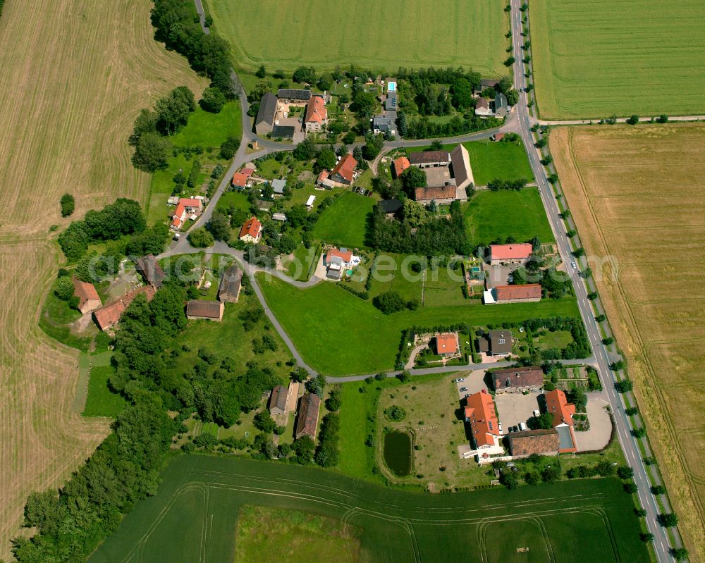 Aerial photograph Plotitz - Agricultural land and field boundaries surround the settlement area of the village in Plotitz in the state Saxony, Germany