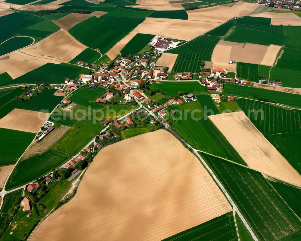 Aerial image Pönning - Agricultural land and field boundaries surround the settlement area of the village in Pönning in the state Bavaria, Germany