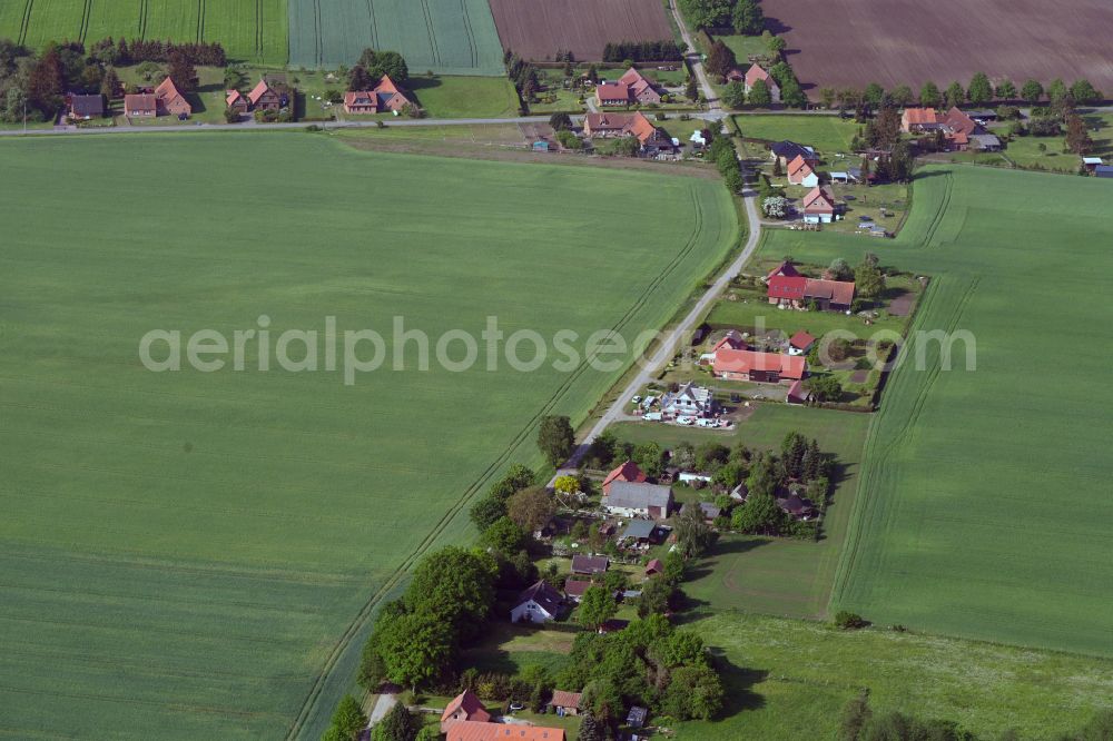 Aerial photograph Pogreß - Agricultural land and field boundaries surround the settlement area of the village in Pogreß in the state Mecklenburg - Western Pomerania, Germany