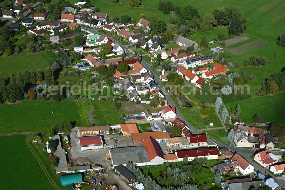 Polzen from above - Agricultural land and field boundaries surround the settlement area of the village in Polzen in the state Brandenburg, Germany