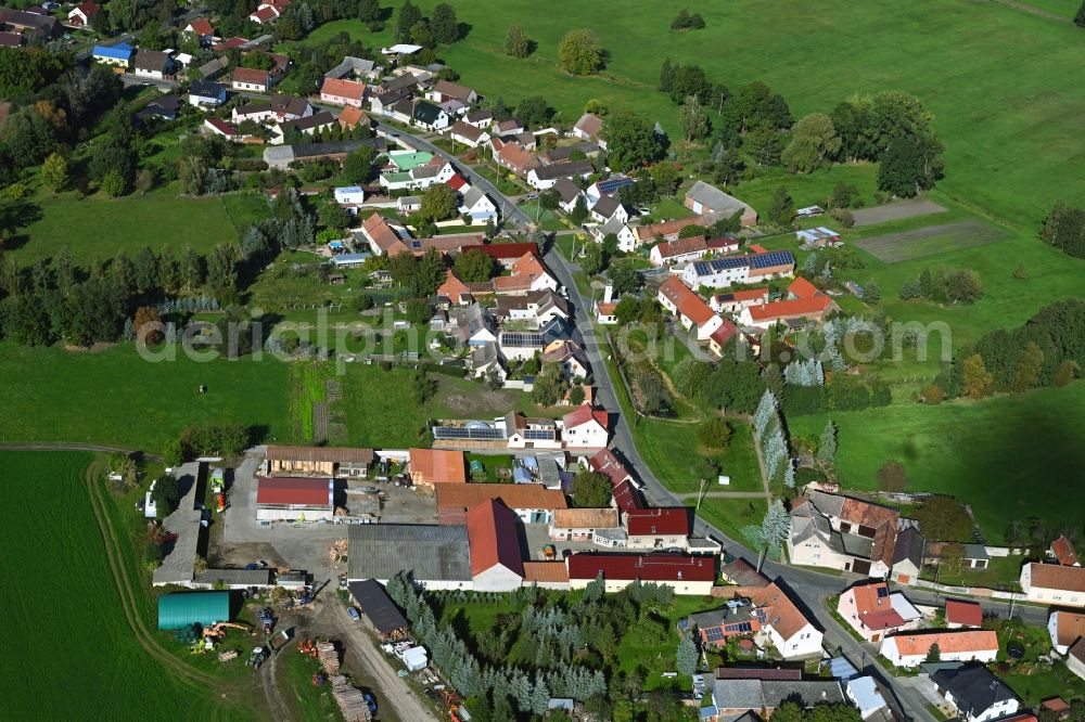 Polzen from the bird's eye view: Agricultural land and field boundaries surround the settlement area of the village in Polzen in the state Brandenburg, Germany