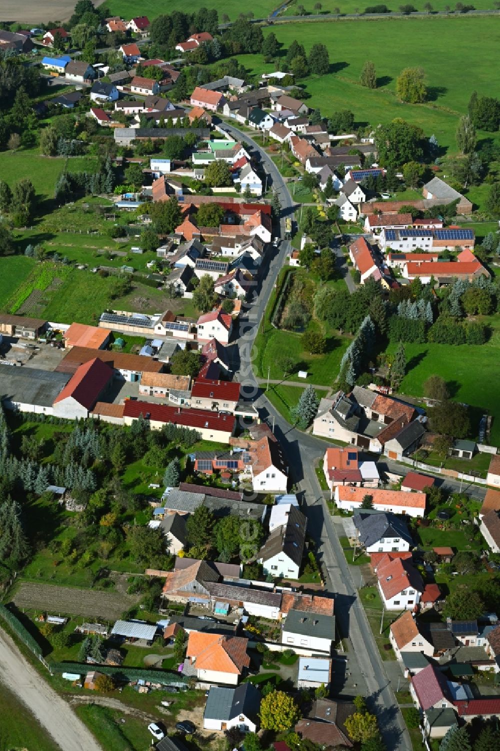 Aerial image Polzen - Agricultural land and field boundaries surround the settlement area of the village in Polzen in the state Brandenburg, Germany